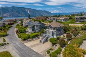 an aerial view of a house with a driveway at Beaches and Breezes on Wapato - 4 Bed 4 Bath Vacation home in Wapato Point in Manson