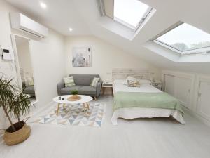 Ένα ή περισσότερα κρεβάτια σε δωμάτιο στο Coqueto estudio en Sanxenxo