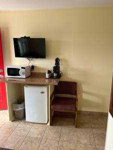 Kuchyň nebo kuchyňský kout v ubytování All Star Inn & Suites