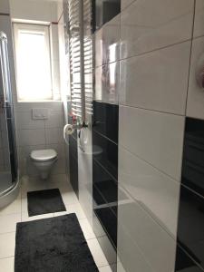 Koupelna v ubytování Mieszkanie u Anety na Krótkiej + 13 fotografií