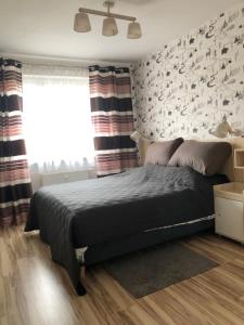 Postel nebo postele na pokoji v ubytování Mieszkanie u Anety na Krótkiej