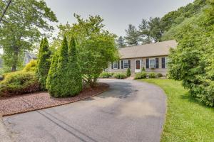 a driveway leading to a house with trees at Ideal Narragansett Location with Furnished Deck! in Narragansett