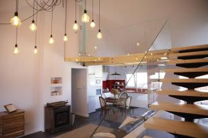 a kitchen and dining room with a table and chairs at Casa Pieiteiro in Corcubión