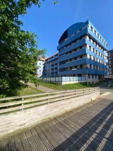 a building with a bench in front of it at Blue house Bermeo in Bermeo