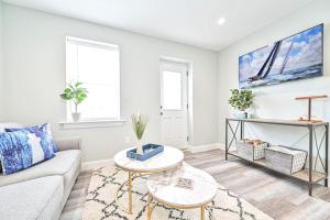 a living room with a couch and a table at 318 E Youngs Ave Unit 5 Salty Shore Oasis Spectacular Retreat in Wildwood