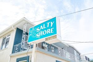 een bordje voor zoute opslag bovenop een huis bij 318 E Youngs Ave Unit 7 Salty Shore Retreat Coastal Charm Tranquility in Wildwood