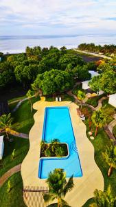 an overhead view of a swimming pool at a resort at El Arrecife Martin Pescador in Taxisco