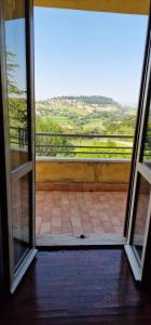 an open door with a view of a patio at La Corte sul Conero Casa Vacanze in Camerano