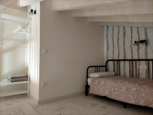 a small bedroom with a bed and a window at Picos de Europa Chic & Cool Apartments in Puertas