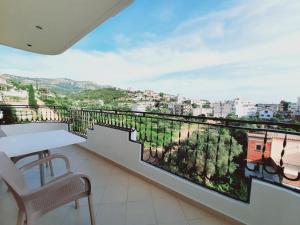 a balcony with a view of a city at Amarildo Hotel in Himare