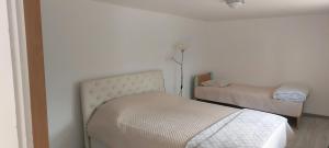 Postel nebo postele na pokoji v ubytování Fontana Apartman
