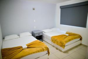 Postel nebo postele na pokoji v ubytování Mona Inn