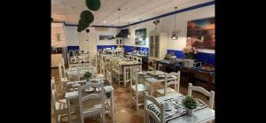 Reštaurácia alebo iné gastronomické zariadenie v ubytovaní Hostal El Puerto Boutique