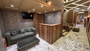 a living room with a couch and a television at Mar Boutique Apartment in Istanbul