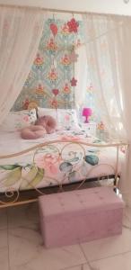 a bedroom with a bed with a canopy at ViLLETTA CLAUDETTA in Laveno-Mombello