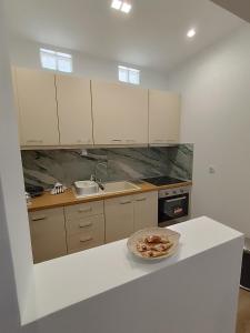 Kuchyň nebo kuchyňský kout v ubytování Selinia Residence