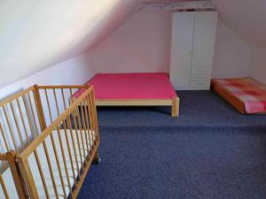 a small room with two beds and a cabinet at Rekreační dům u Elišky a Barušky in Krakovany