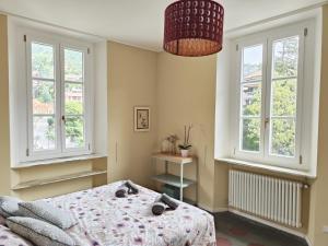 Postel nebo postele na pokoji v ubytování Elegant Sweet Apt Cernobbio Centro