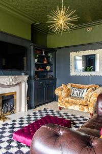 a living room with a couch and a fireplace at The Canoeists Hideaway in Seaton Carew