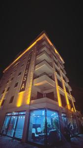 a building with lights on top of it at night at Melissa Suite Otel in Trabzon