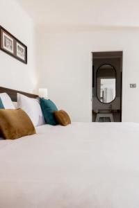 Postel nebo postele na pokoji v ubytování Capricorn Hotel Suva