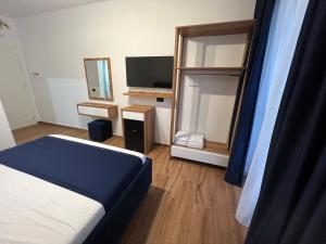 Postel nebo postele na pokoji v ubytování ILLYRIAN hotel Ksamil