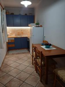 Kuchyň nebo kuchyňský kout v ubytování Theros Apartment