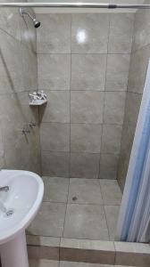a bathroom with a shower and a sink at Hotel MIRALMAR in El Puente