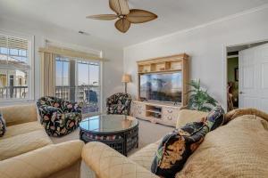 a living room with couches and a flat screen tv at Sunset Island Luxury 3BR Unit – Free Linen Package in Ocean City