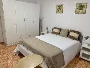 Postel nebo postele na pokoji v ubytování Apartamentos custodio