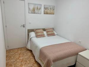 Postel nebo postele na pokoji v ubytování Apartamentos custodio