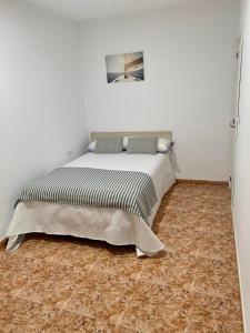 Postel nebo postele na pokoji v ubytování Apartamentos custodio