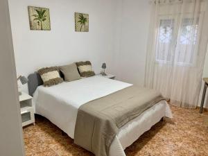 Postel nebo postele na pokoji v ubytování Apartamentos custodio