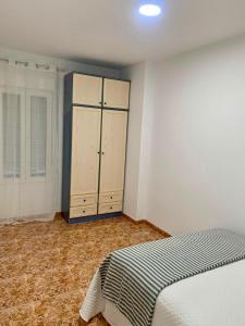 Postel nebo postele na pokoji v ubytování Apartamentos custodio