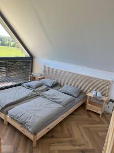 Ένα ή περισσότερα κρεβάτια σε δωμάτιο στο Polana Modraszek