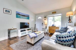 a living room with a couch and a tv at Pet-Friendly Orlando Home Near Hospitals in Orlando