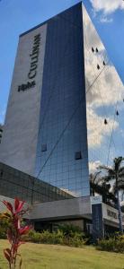 a building with kites flying in front of it at CULLINAN Brasilia flat particular em Hotel junto ao Shopping - SEM CAFE in Brasilia
