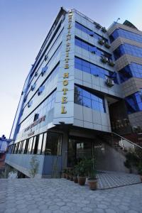 a building with a sign on the front of it at Hotel Meridian Suite in Kathmandu