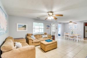 a living room with two couches and a table at Keystone Heights Vacation Rental On the Lake! in Keystone Heights