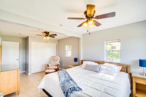 a bedroom with a bed and a ceiling fan at Keystone Heights Vacation Rental On the Lake! in Keystone Heights