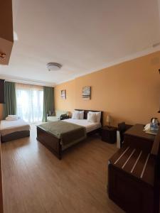Postel nebo postele na pokoji v ubytování Hotel Brighton