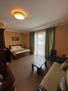 Postel nebo postele na pokoji v ubytování Hotel Brighton