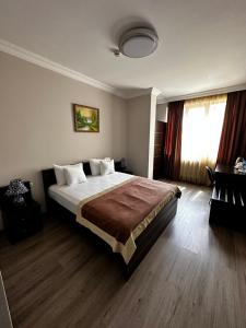 Postel nebo postele na pokoji v ubytování Hotel Brighton