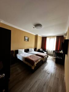 Postel nebo postele na pokoji v ubytování Hotel Brighton
