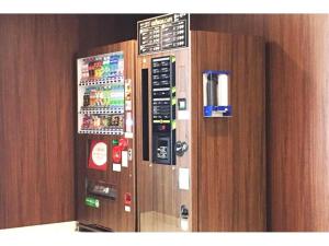 a vending machine with buttons and magnets on a wall at HOTEL LANTANA OSAKA - Vacation STAY 49019v in Osaka