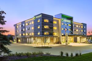 a building with a parking lot in front of it at Element Dallas Las Colinas in Irving