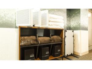 a room with a shelf with towels and a window at Hotel AreaOne Wadayama - Vacation STAY 10557v in Asago +22 photos