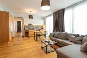 a living room with a couch and a table at Ando Living - Taksim Gumussuyu Townhouse in Istanbul