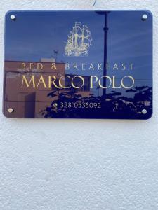 a sign for a bed and breakfast marco polo at B&B Marco Polo in Terrasini