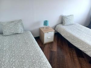 Säng eller sängar i ett rum på Oporto Sea Rooms